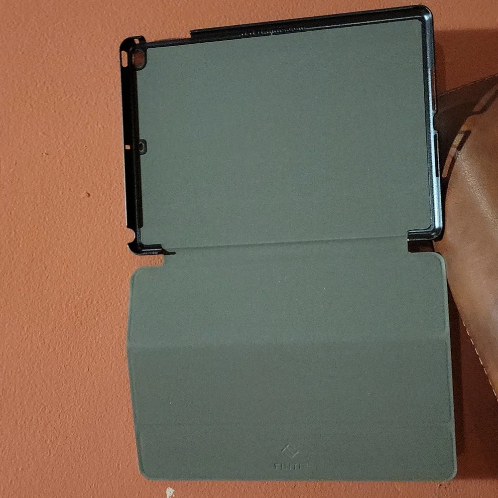 IPad min cover that looks like a school composition book and it black and white